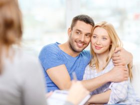 young couple hugging at psychologist office